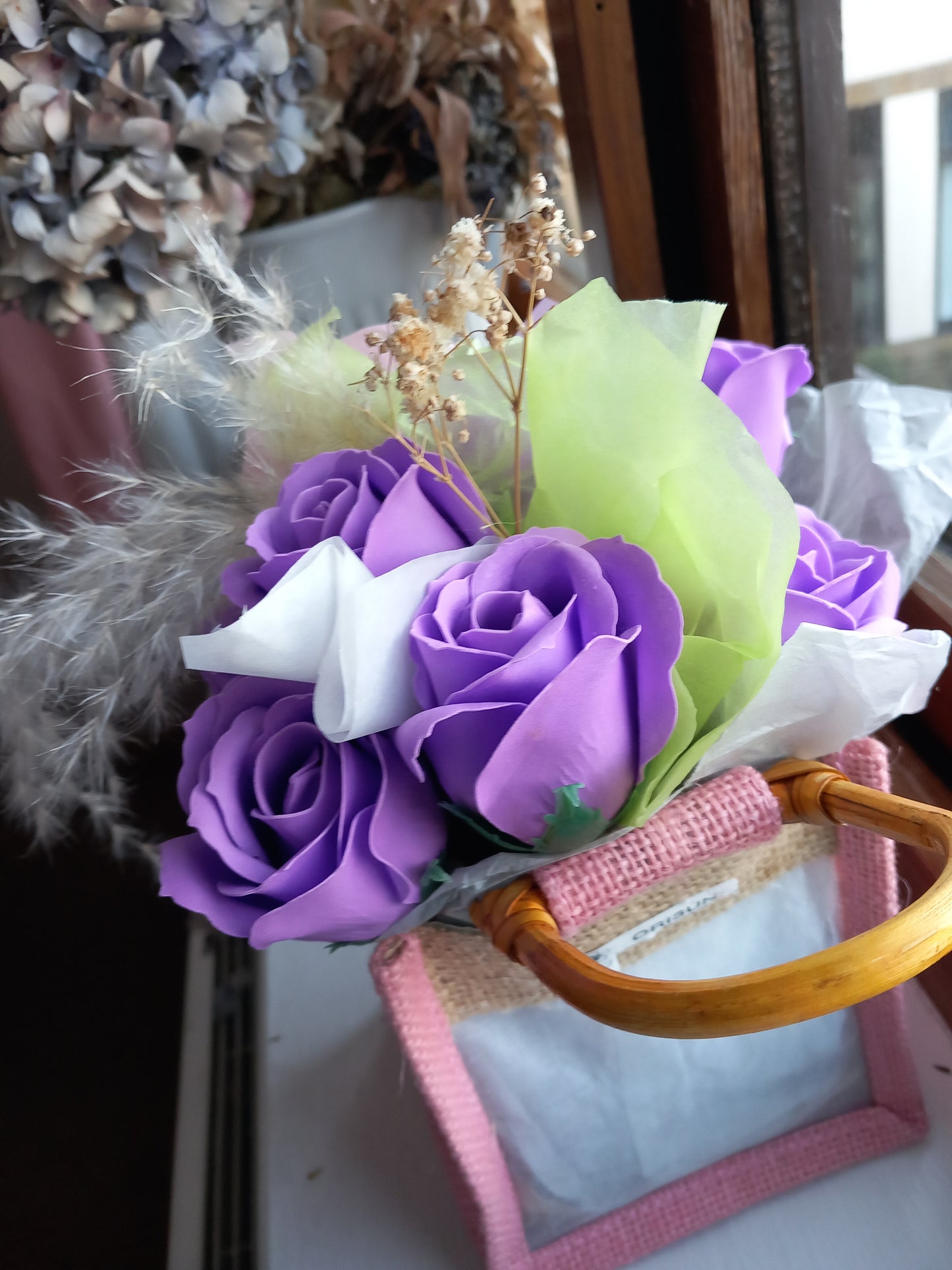 PURPLE SOAP ROSES IN PINK JUTE BAG