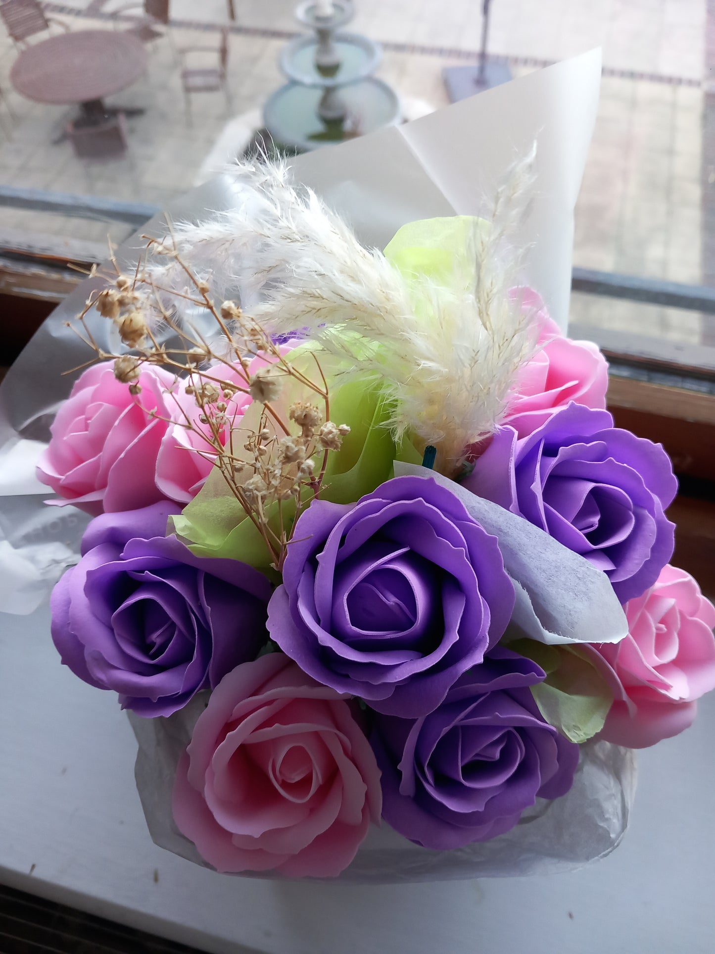 PURPLE AND PINK SOAP ROSES IN PINK JUTE BAG