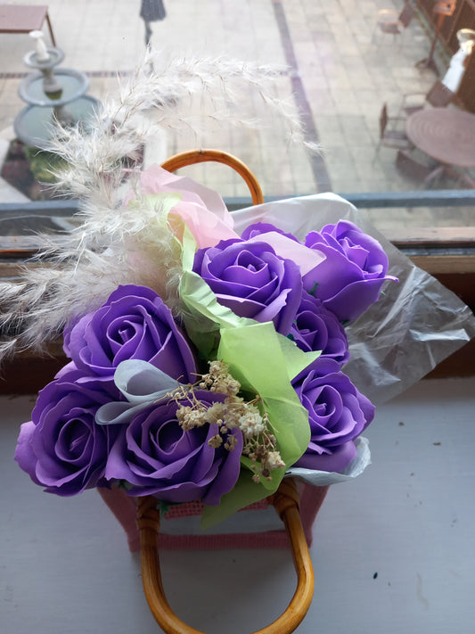 PURPLE SOAP ROSES IN PINK JUTE BAG