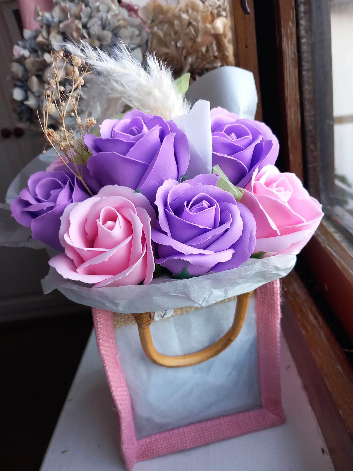 PURPLE AND PINK SOAP ROSES IN PINK JUTE BAG