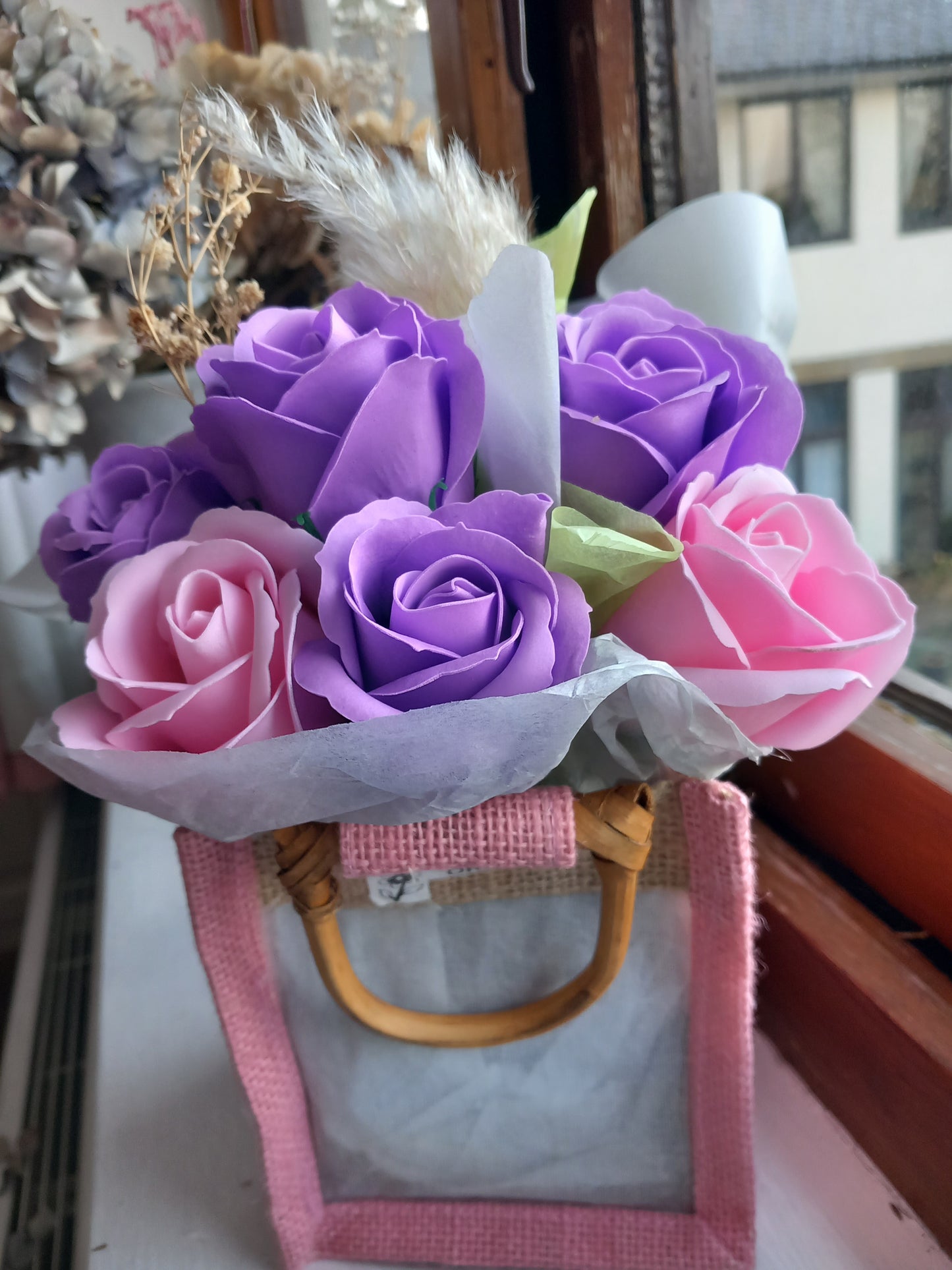 PURPLE AND PINK SOAP ROSES IN PINK JUTE BAG