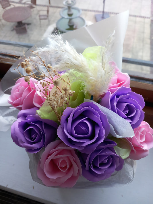 PURPLE AND PINK SOAP ROSES IN PINK JUTE BAG